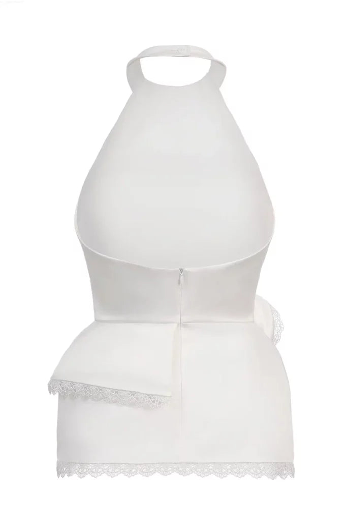 Top with an open back and a frill