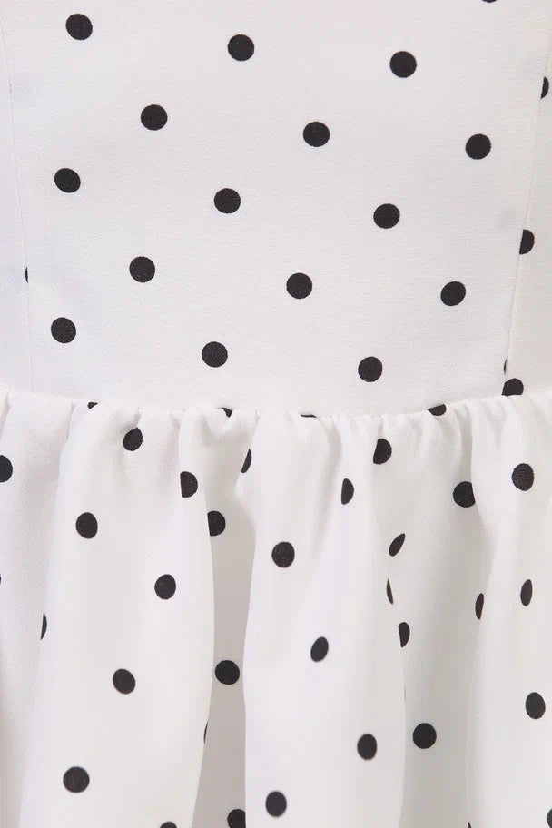 Top with an open back and polka dots