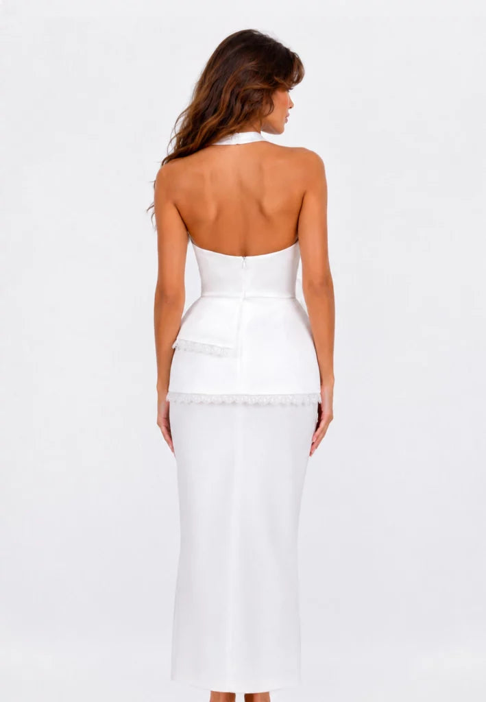 Top with an open back and a frill