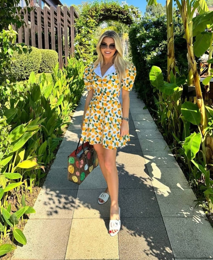 Button-down short-sleeved lemon-colored mini dress