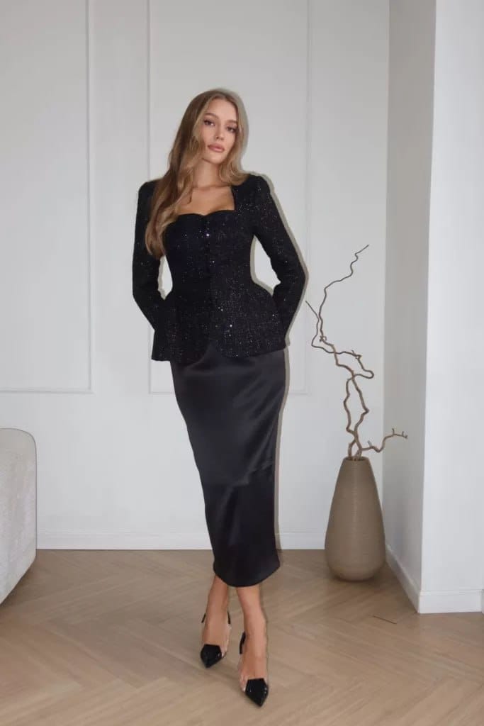 A long‑sleeved tweed top