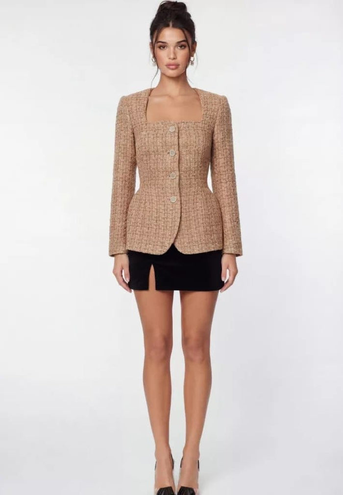 A long‑sleeved tweed top